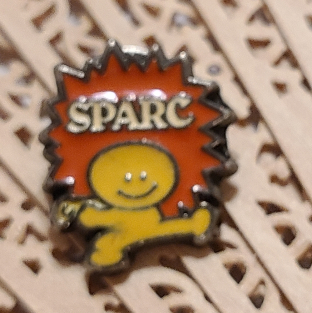 SPARC Collectible Pin with Orange and Yellow Design - Picture 2 of 5